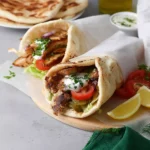 Delicious Chicken Shawarma served with fresh vegetables and sauces