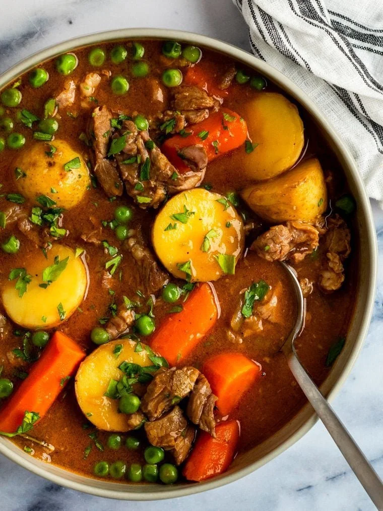 Hearty lamb stew with fresh vegetables in a rustic bowl