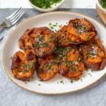 Delicious smashed sweet potatoes topped with herbs and spices