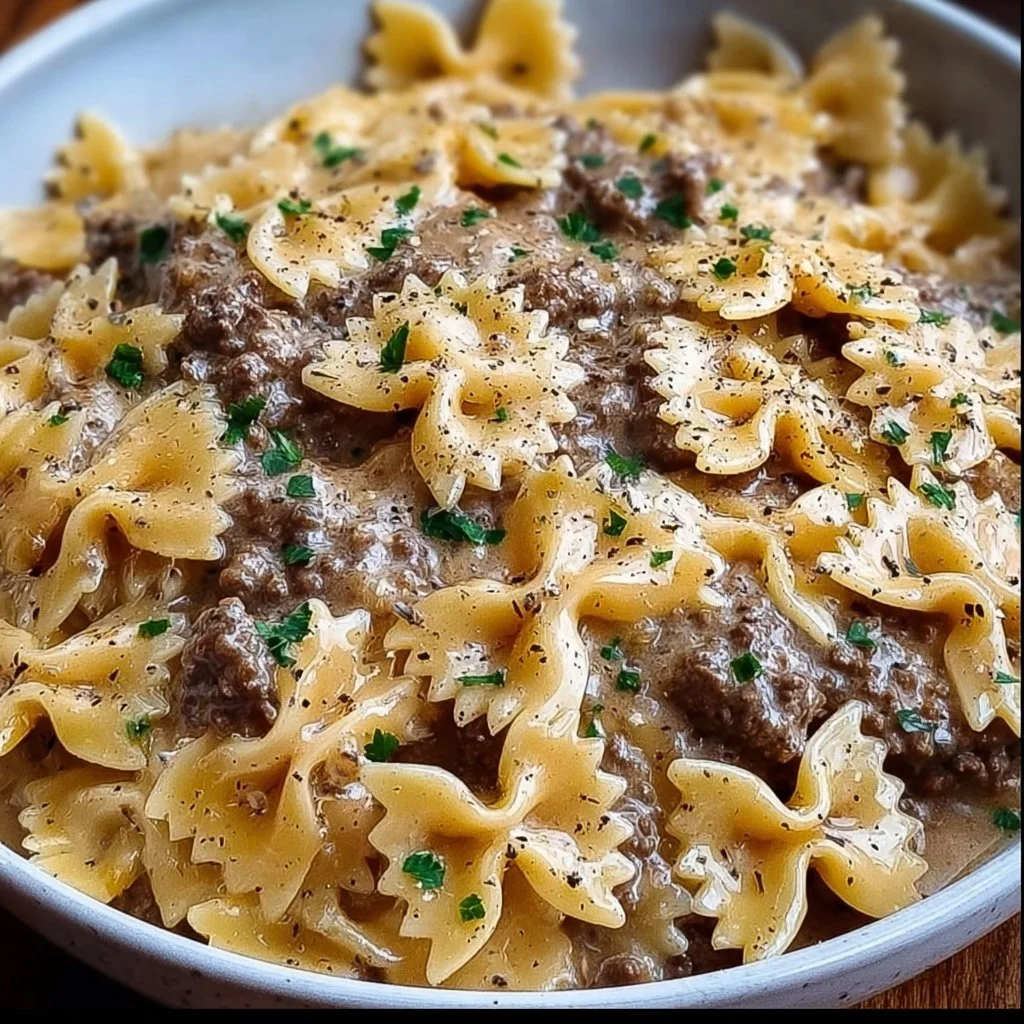 Creamy Parmesan garlic beef bowtie pasta served in a bowl