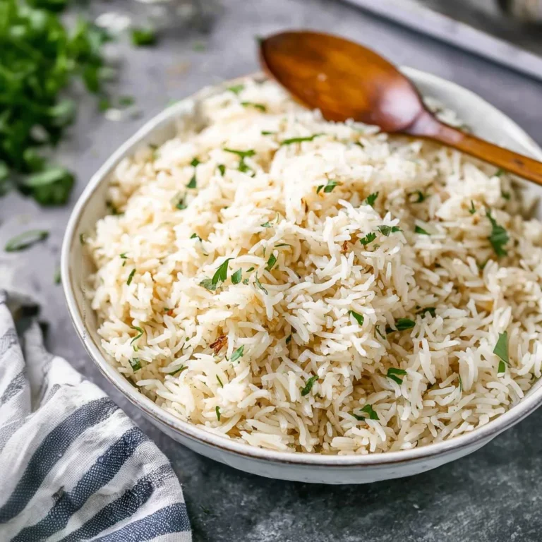 Bowl of easy rice pilaf garnished with herbs and spices