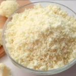 A bowl of freshly made cauliflower rice with chopped vegetables and herbs.