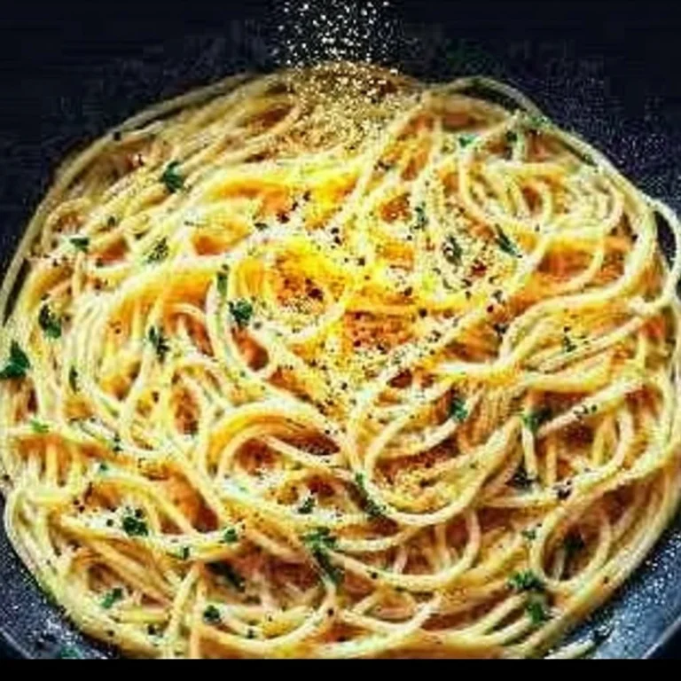 A bowl of Midnight Pasta, featuring delicious ingredients and a cozy ambiance.