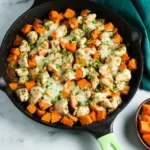 Delicious Sweet Potato Pesto Chicken Skillet served with vibrant vegetables