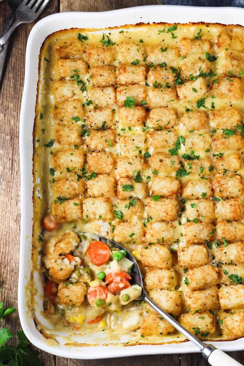 Tater Tot Chicken Pot Pie Casserole served in a dish, topped with golden crispy tots.