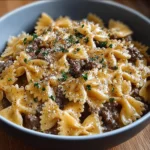 Creamy Parmesan garlic beef bowtie pasta served in a bowl
