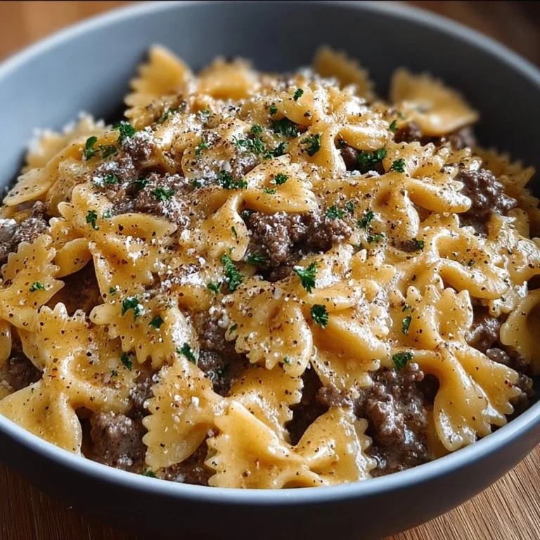 Creamy Parmesan garlic beef bowtie pasta served in a bowl