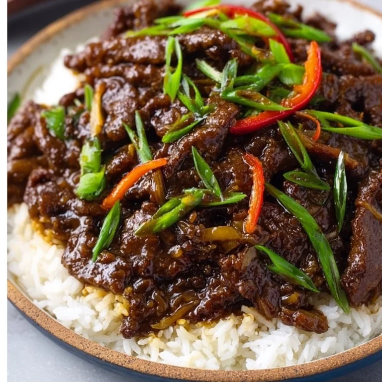 Delicious plated Mongolian Beef dish served with vegetables and rice