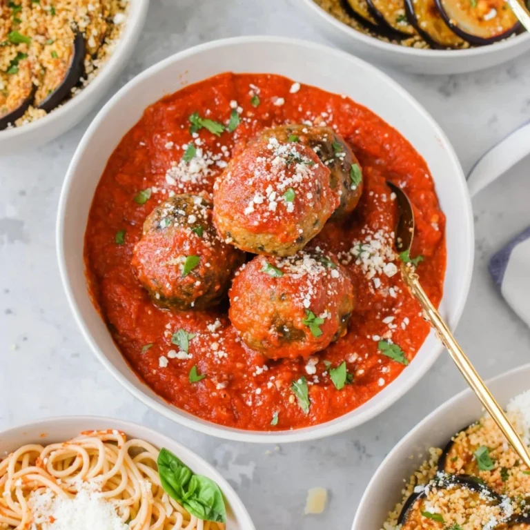 Savory eggplant meatballs served with fresh herbs and sauce