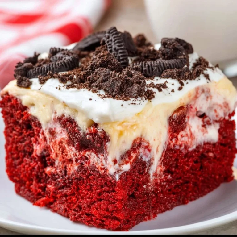 Delicious red velvet poke cake with cream cheese filling and vibrant red color.