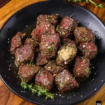 Air fryer garlic butter steak bites served on a plate
