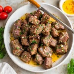 Air Fryer steak bites with lemon garlic butter served on a plate