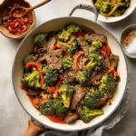 Delicious Beef and Broccoli Stir-Fry dish served with rice on a plate
