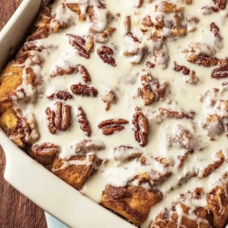 Delicious cinnamon roll casserole served warm with icing