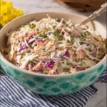 Bowl of classic coleslaw with fresh ingredients ready to serve.