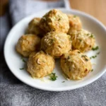 Delicious cheesy baked turkey meatballs in a serving dish, perfect for weeknight dinners.