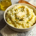 Delicious garlic mashed potatoes served in a bowl, perfect comfort food.