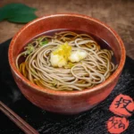 Delicious bowl of Kake Soba, a simple hot soba noodle soup ready to savor.