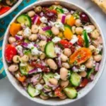 Vibrant Mediterranean Dense Bean Salad served in a bowl