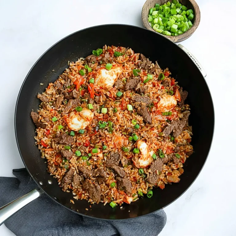 Delicious bowl of bulgogi fried rice with vibrant vegetables and savory beef.