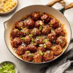 Delicious sweet and sour meatballs served in a warm dish, showcasing a classic recipe.