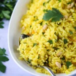 Delicious Mediterranean yellow rice served in a bowl with fresh herbs