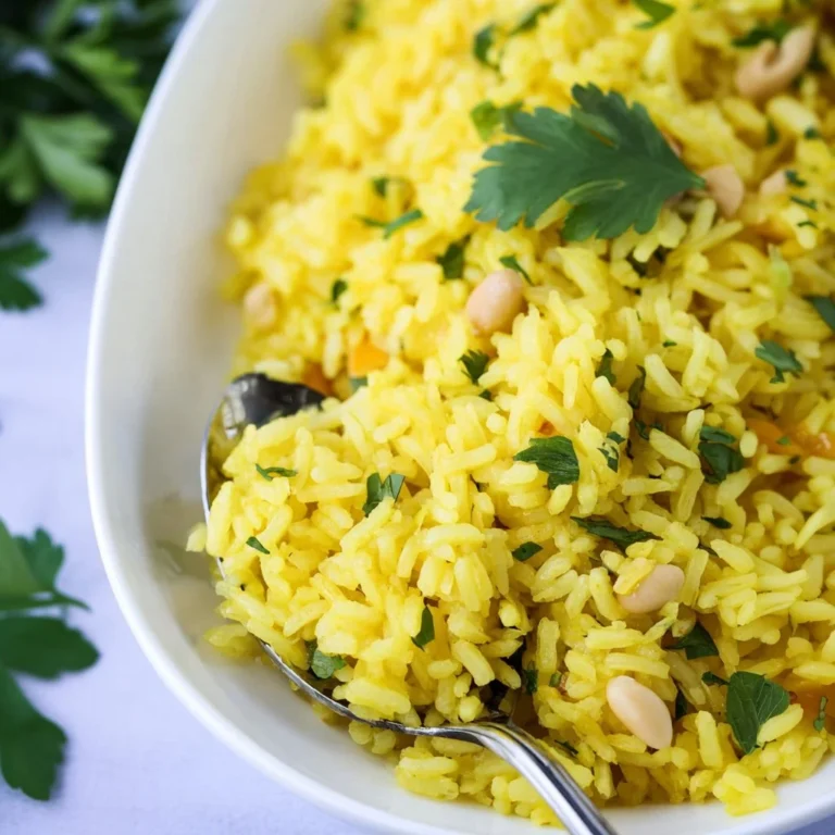 Delicious Mediterranean yellow rice served in a bowl with fresh herbs