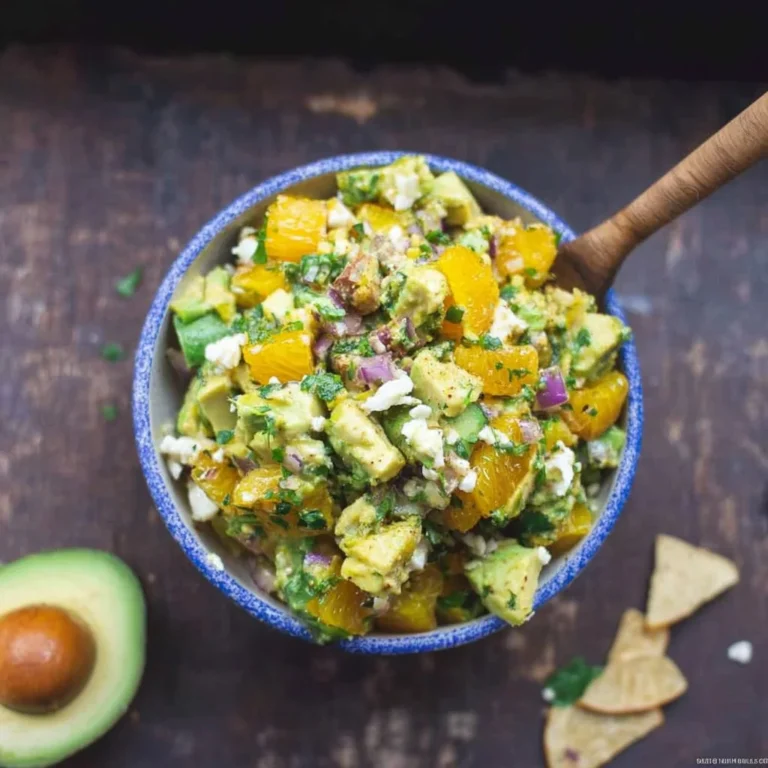 Bowl of vibrant Citrus Avocado Salsa with fresh ingredients and chips