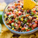 Delicious Cowboy Caviar recipe featuring fresh vegetables and beans.