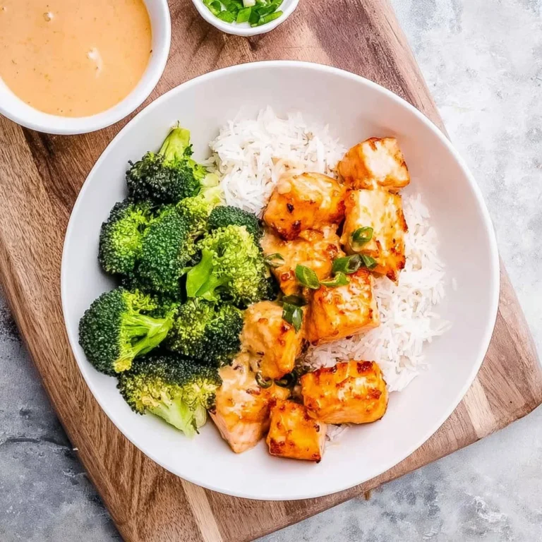 Delicious Bang Bang Salmon dish garnished with fresh herbs