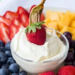 Delicious fruit dip served with fresh assorted fruits on a platter.