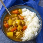 Delicious bowl of homemade Japanese curry rice served with vegetables and meat