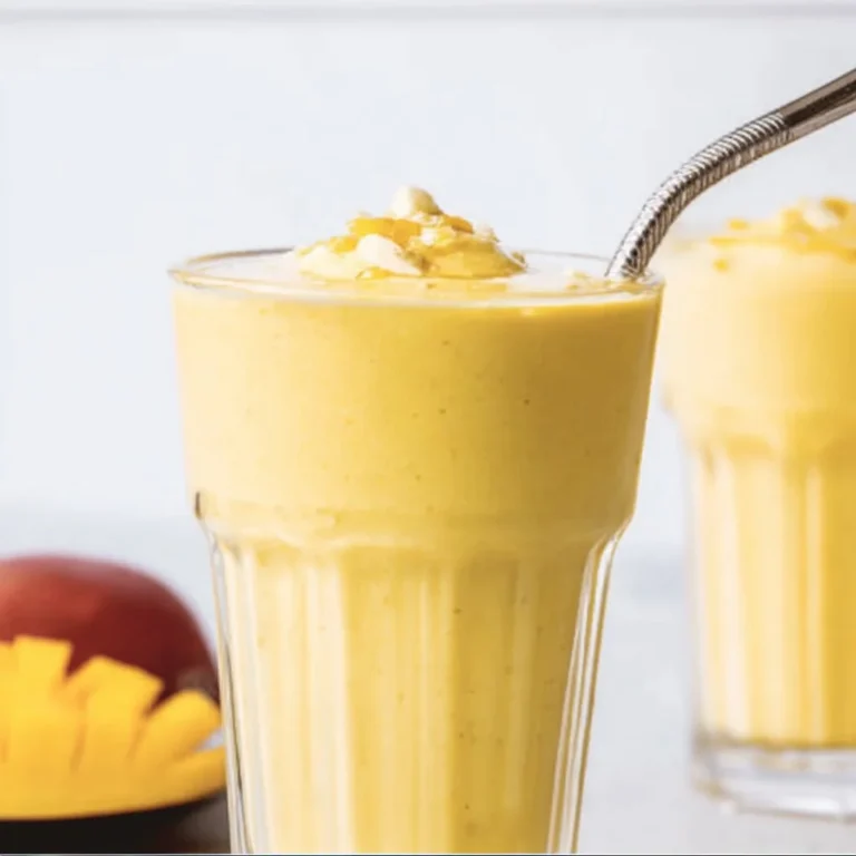 Glass of creamy Mango Lassi, a tropical drink made with mangoes and yogurt