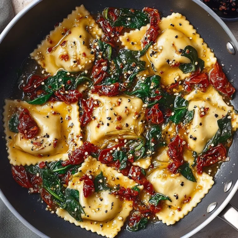 Delicious ravioli with sun-dried tomatoes, artichokes, and spinach served in a bowl
