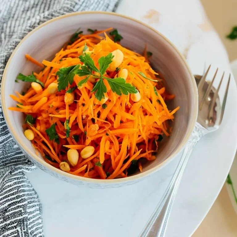 Freshly prepared French carrot salad with herbs and dressing