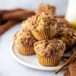 Delicious coffee cake muffins served on a plate, perfect for family gatherings.
