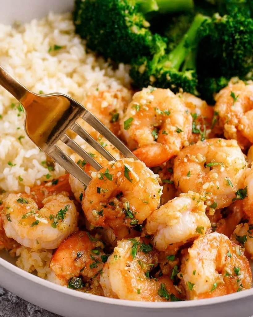 Delicious honey garlic shrimp served on a plate with vegetables