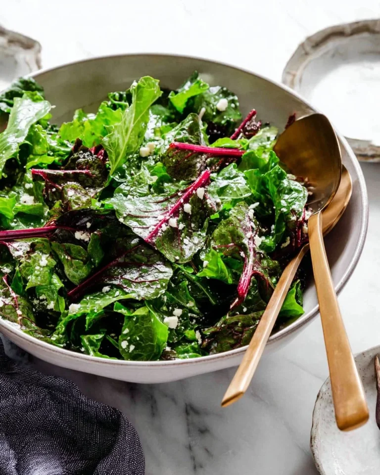 Colorful and fresh beet green salad featuring vibrant greens and roasted beet slices.