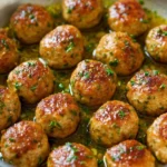 Juicy chicken meatballs served with marinara sauce and herbs