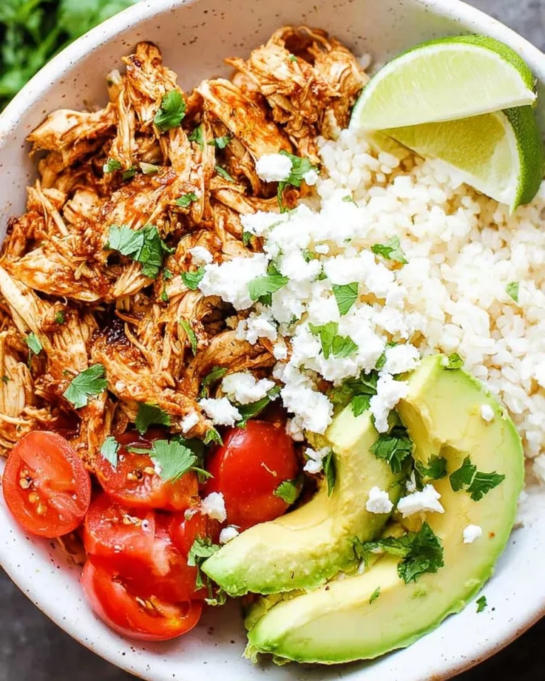 Delicious Chicken Tinga served in tacos with fresh toppings