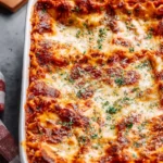 A hearty serving of cottage cheese lasagna layered with rich tomato sauce and cheese.