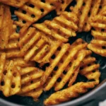 Crispy air fryer frozen waffle fries served as a quick comfort snack