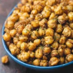 Bowl of crispy roasted chickpeas seasoned with spices