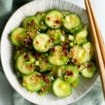 Fresh cucumber salad with vibrant vegetables and dressing