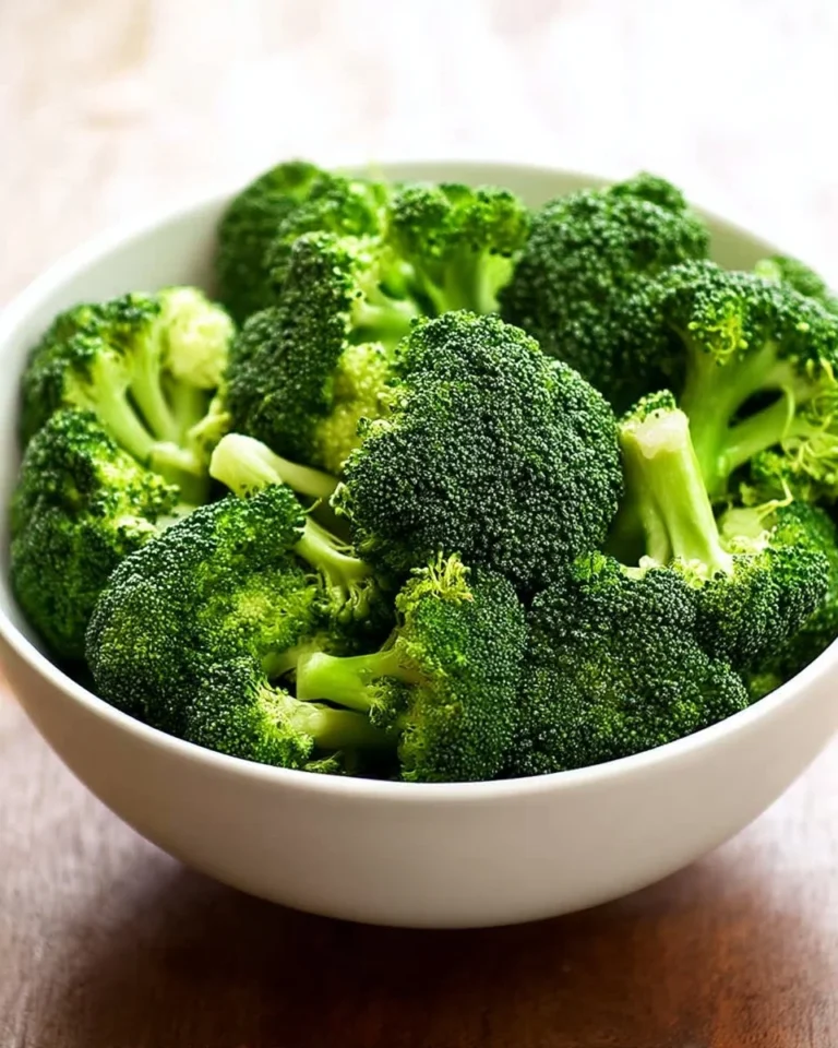 Easy microwave broccoli prepared in a bowl with seasonings.