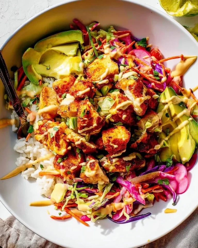 Delicious fish taco bowl featuring fresh fish, toppings, and vibrant colors.