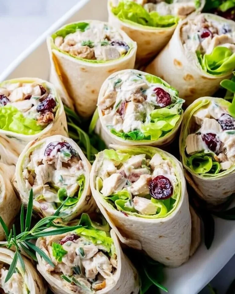 Healthy chicken salad wraps filled with fresh ingredients and served on a tortilla.
