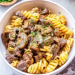 A delicious bowl of Instant Pot Beef Stroganoff with creamy sauce and noodles.