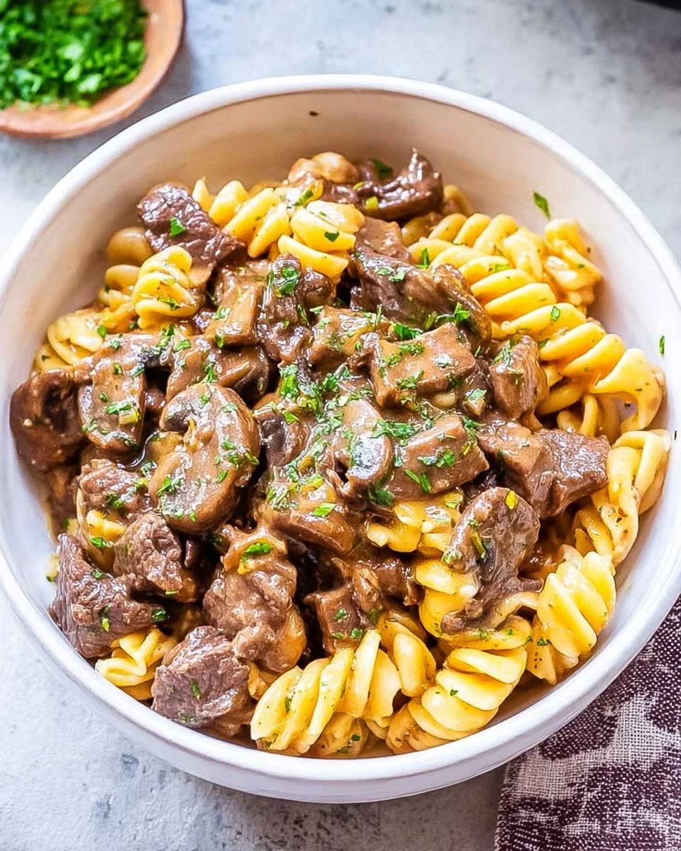 A delicious bowl of Instant Pot Beef Stroganoff with creamy sauce and noodles.