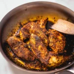 Juicy Italian seasoning chicken garnished with herbs and spices, ready to serve.